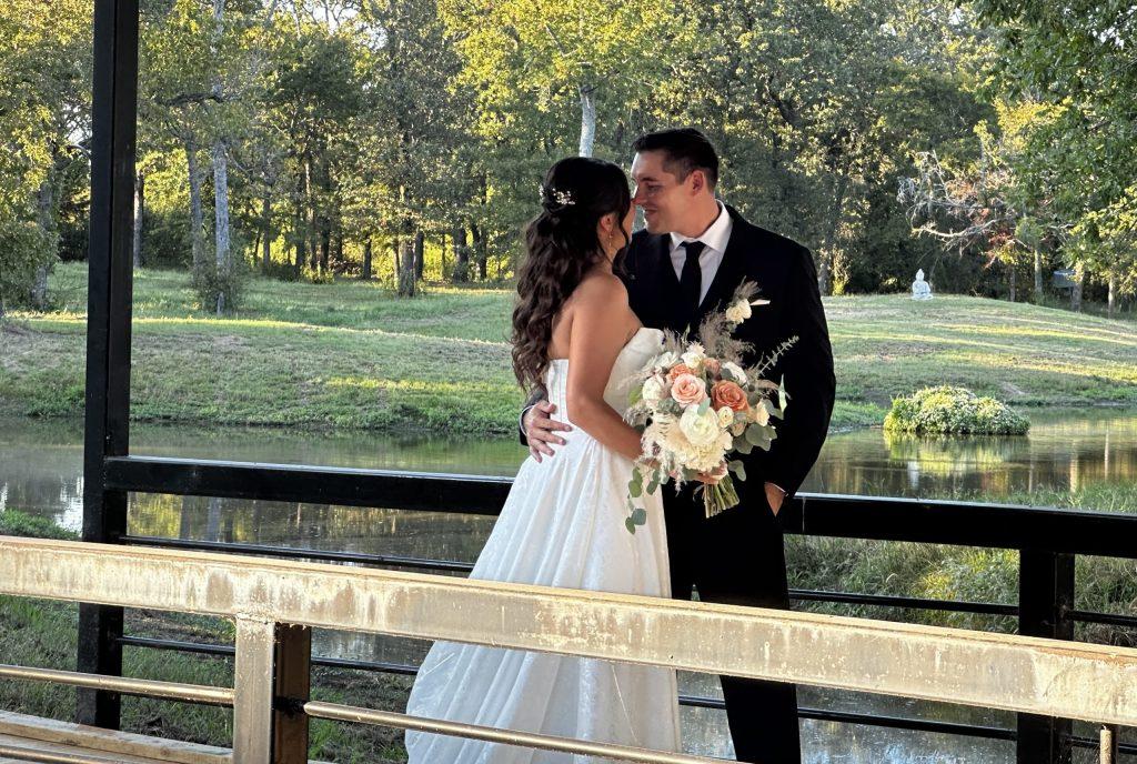 Bride and groom on bridge